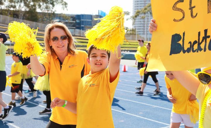 Students and adults show thier support walking around the stadium for Western Sydney School at Sports Carnival 2018